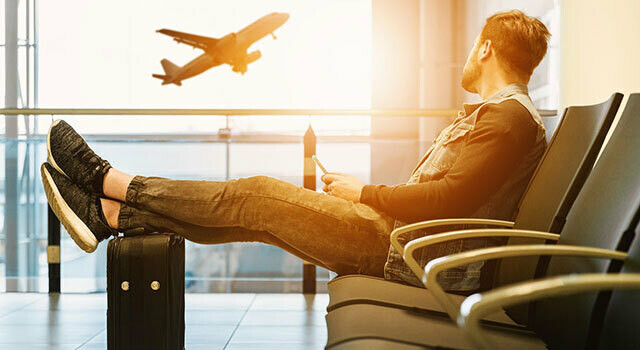 young man waiting at airport gate.jpg